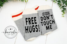 Load image into Gallery viewer, Free Hugs Just Kidding Don&#39;t Touch Me Socks
